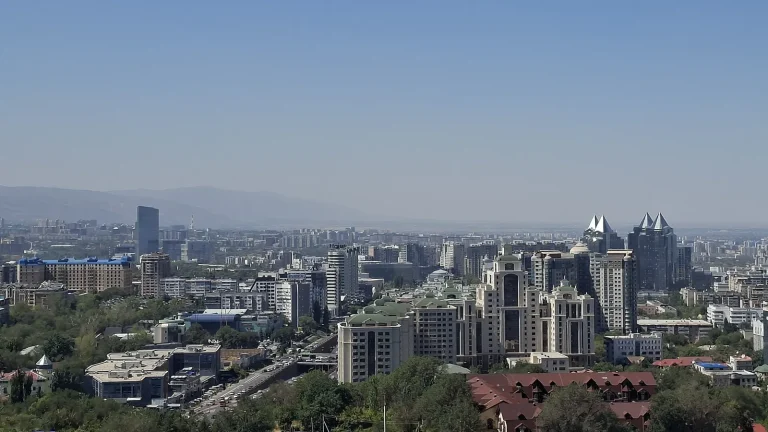 From Speeches to Servers: Central Asia’s Sovereign Internet Push The Almaty skyline in Kazakhstan with mountains behind the city